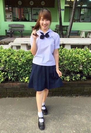 Oriental schoolgirl with a charming